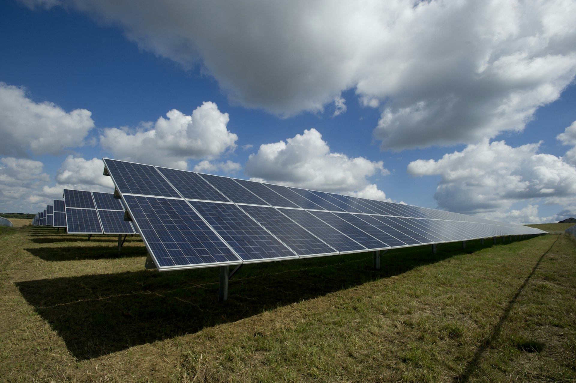 Solar panels at sunrise in front of mountains of central Spain